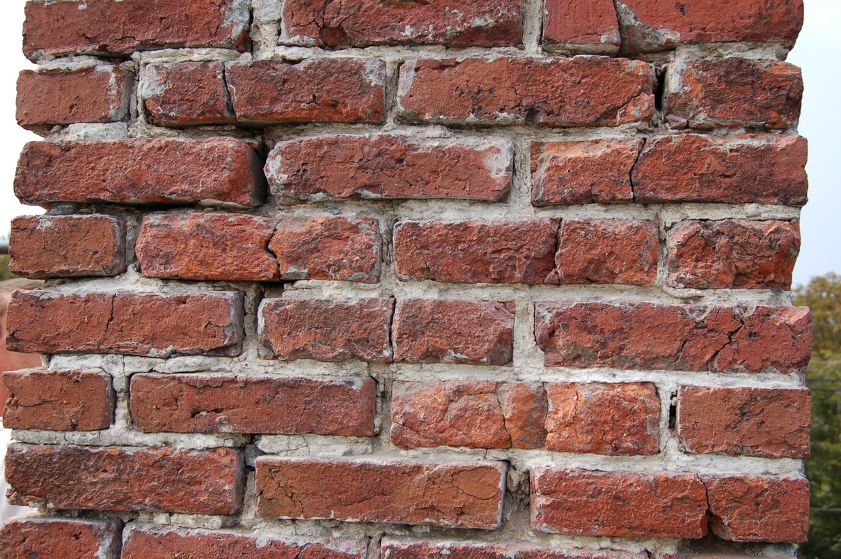 Original historic brick badly damaged by Portland cement
