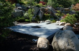Custom pond filter system hidden under bluestone patio