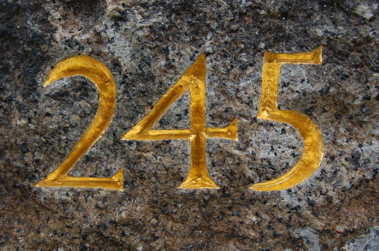 hand carved numbers on granite