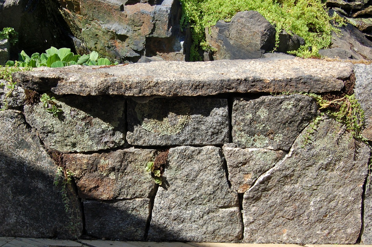 Weathered granite wall with bench
